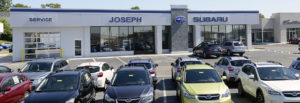 Joseph Subaru building with cars parked in front